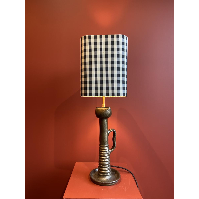 Bronze table lamp with a black and white checkered silk lampshade
