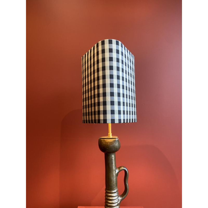 Bronze table lamp with a black and white checkered silk lampshade