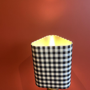 Bronze table lamp with a black and white checkered silk lampshade