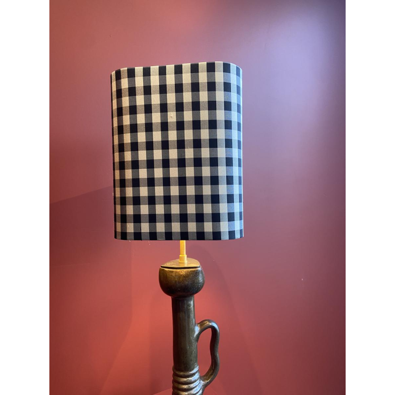 Bronze table lamp with a black and white checkered silk lampshade