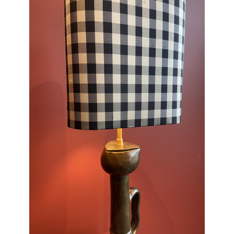 Bronze table lamp with a black and white checkered silk lampshade