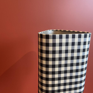 Bronze table lamp with a black and white checkered silk lampshade