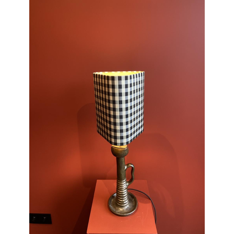 Bronze table lamp with a black and white checkered silk lampshade