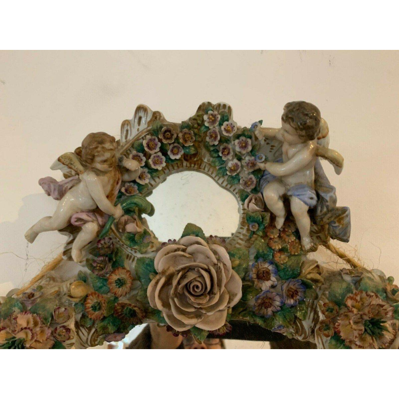Pair of mirrors with candlesticks, decorated with cherubs, German polychrome porcelain, early 20th century
