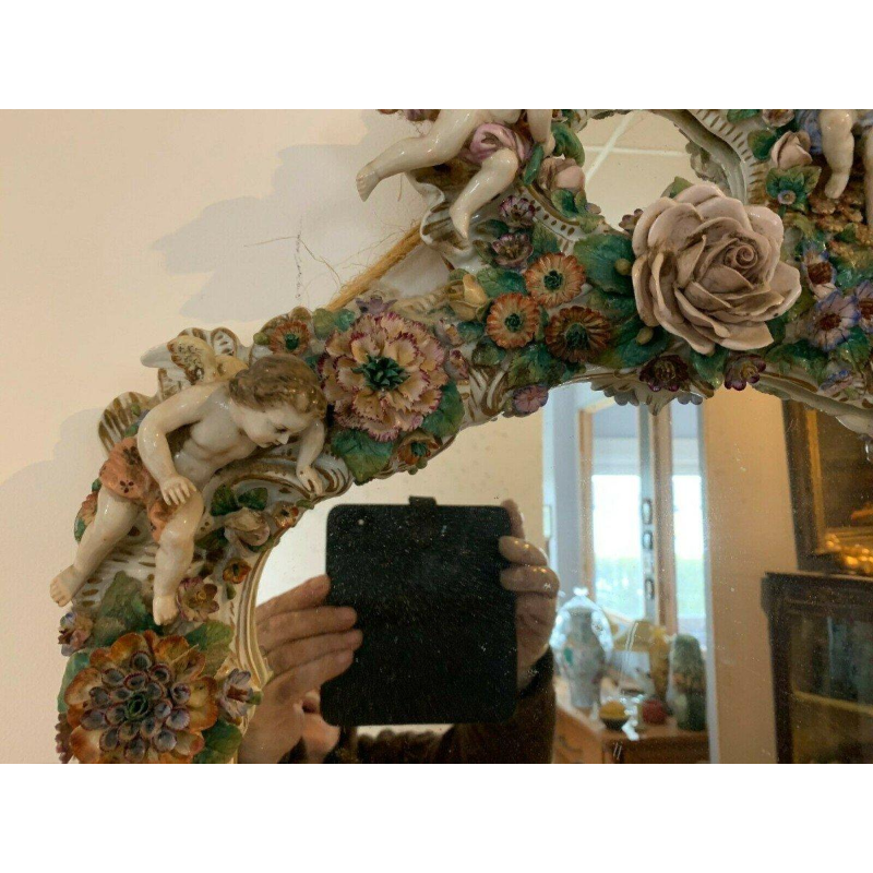 Pair of mirrors with candlesticks, decorated with cherubs, German polychrome porcelain, early 20th century