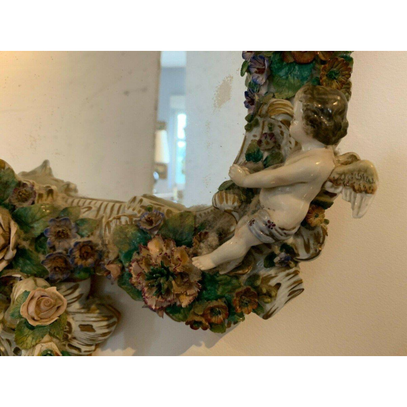 Pair of mirrors with candlesticks, decorated with cherubs, German polychrome porcelain, early 20th century