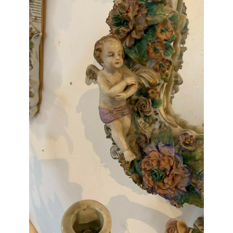 Pair of mirrors with candlesticks, decorated with cherubs, German polychrome porcelain, early 20th century