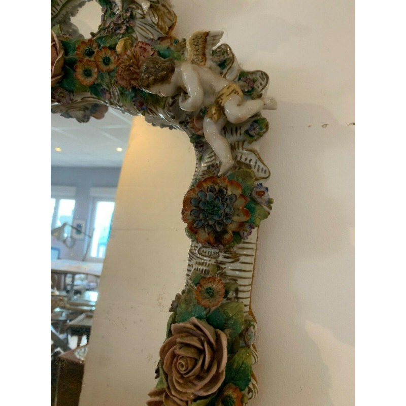 Pair of mirrors with candlesticks, decorated with cherubs, German polychrome porcelain, early 20th century