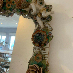 Pair of mirrors with candlesticks, decorated with cherubs, German polychrome porcelain, early 20th century