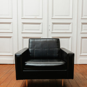Armchair in black imitation leather, 1960