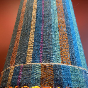 "Stoneware Bottle" lamp with a blue and multicoloured lampshade, handwoven in India
