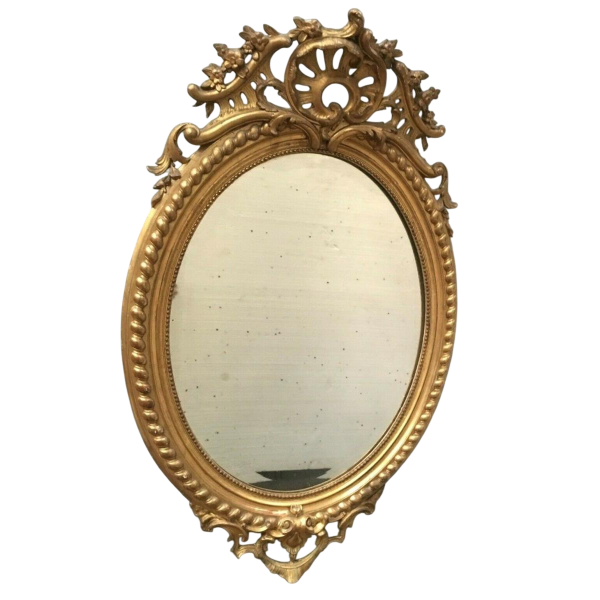 Miroir Louis VX ovale à fronton, bois et stuc doré, glace biseautée, Napoléon III
