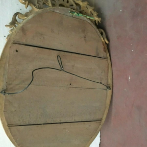 Louis XV oval mirror with pediment, wood and gilt stucco, beveled glass, Napoleon III