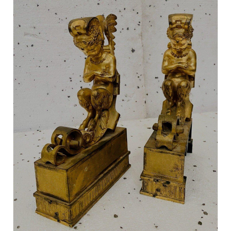 Paire de chenets en bronze doré à décor de faunes ailés, XIXᵉ siècle