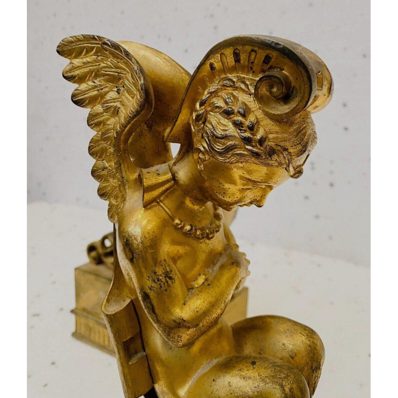 Pair of gilt bronze andirons decorated with winged fauns, 19th century