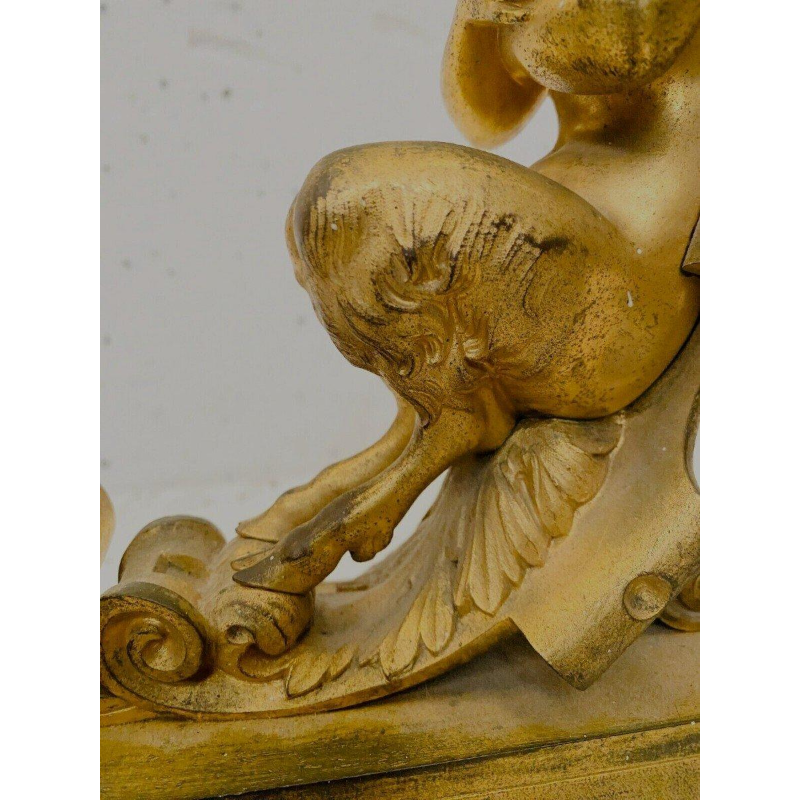 Paire de chenets en bronze doré à décor de faunes ailés, XIXᵉ siècle