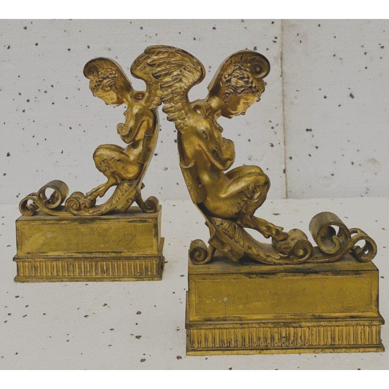 Pair of gilt bronze andirons decorated with winged fauns, 19th century