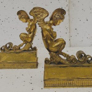 Pair of gilt bronze andirons decorated with winged fauns, 19th century
