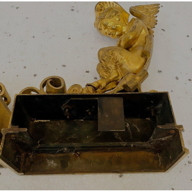 Paire de chenets en bronze doré à décor de faunes ailés, XIXᵉ siècle