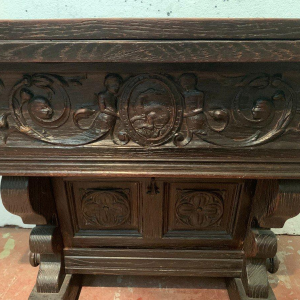 Carved oak table or console, drop-leaf top, 20th century
