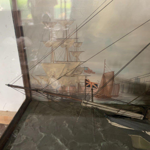 Antique model of a three-masted sailing ship in its display case, 19th century