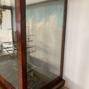Antique model of a three-masted sailing ship in its display case, 19th century