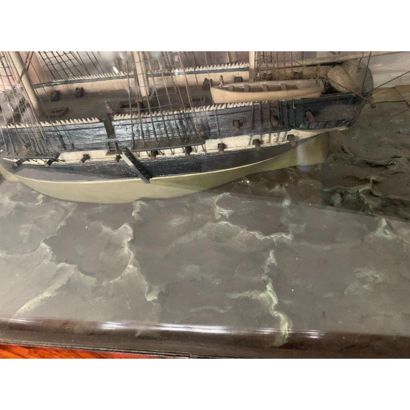 Antique model of a three-masted sailing ship in its display case, 19th century