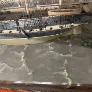 Antique model of a three-masted sailing ship in its display case, 19th century