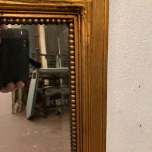 Louis XVI style trumeau mirror in wood and gilded stucco, 20th century