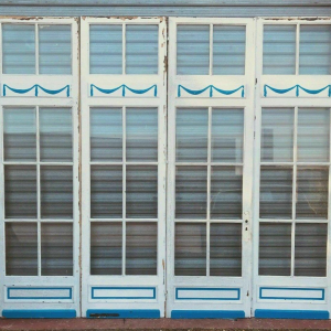 Set of 4 glazed doors, divided into four panels with beveled panes, early 20th century