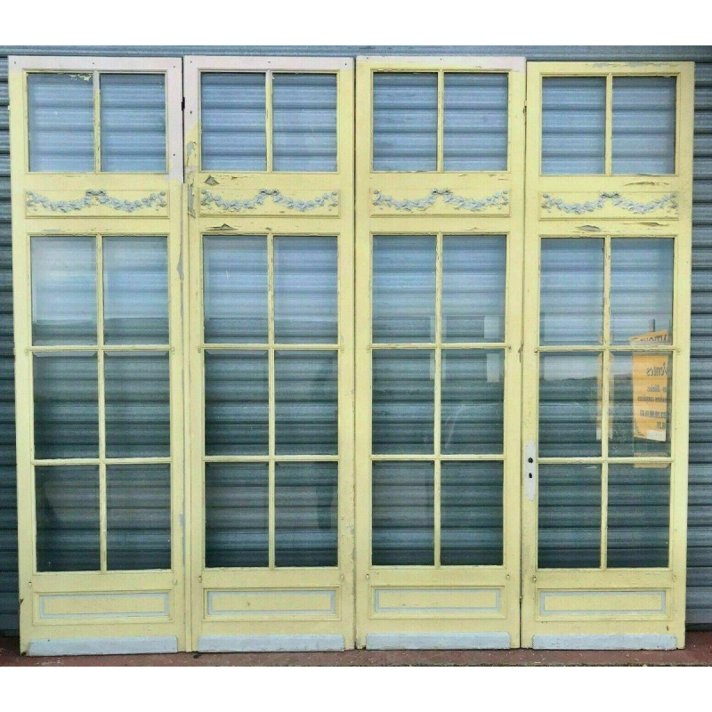 Set of 4 glazed doors, divided into four panels with beveled panes, early 20th century