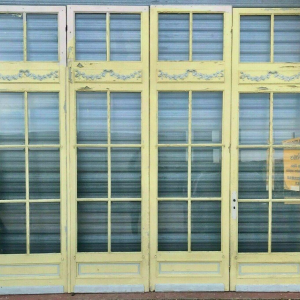Set of 4 glazed doors, divided into four panels with beveled panes, early 20th century