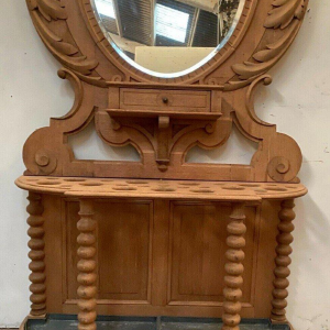 Porte manteau / parapluie / miroir en chêne sculpté, XXᵉ siècle
