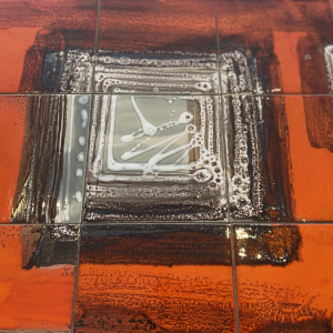 Coffee table in orange ceramic, cylindrical legs in chromed steel, 1960s