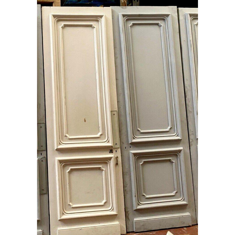 Suite de cinq portes Haussmanniennes moulurées à double faces, XIXᵉ siècle