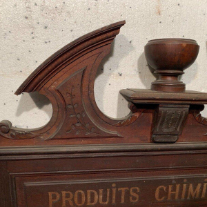Napoleon III style pediment/top of a cabinet inscribed "Chemical Products," natural wood, 19th century