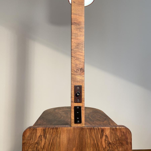 Floor lamp/reading lamp in wood and veneer with orange lampshade, circa 1950