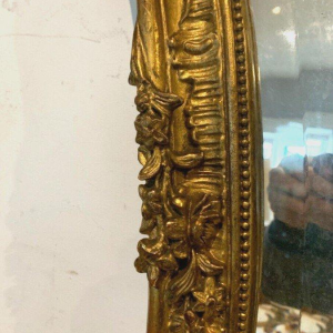 Miroir de style Louis XV Rocaille en bois et stuc doré, début XXᵉ siècle